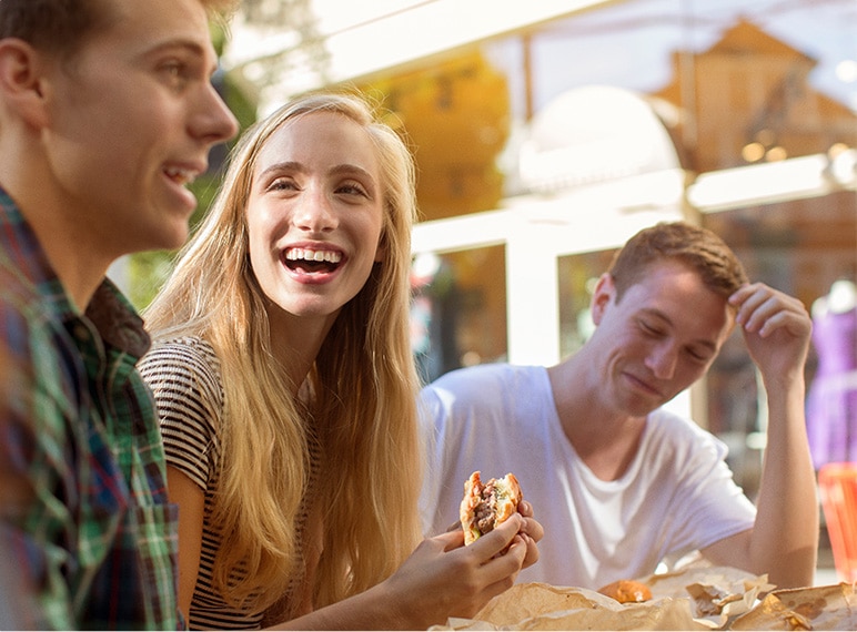 Royal Atlantic Beach Resorts - A cheerful group eating